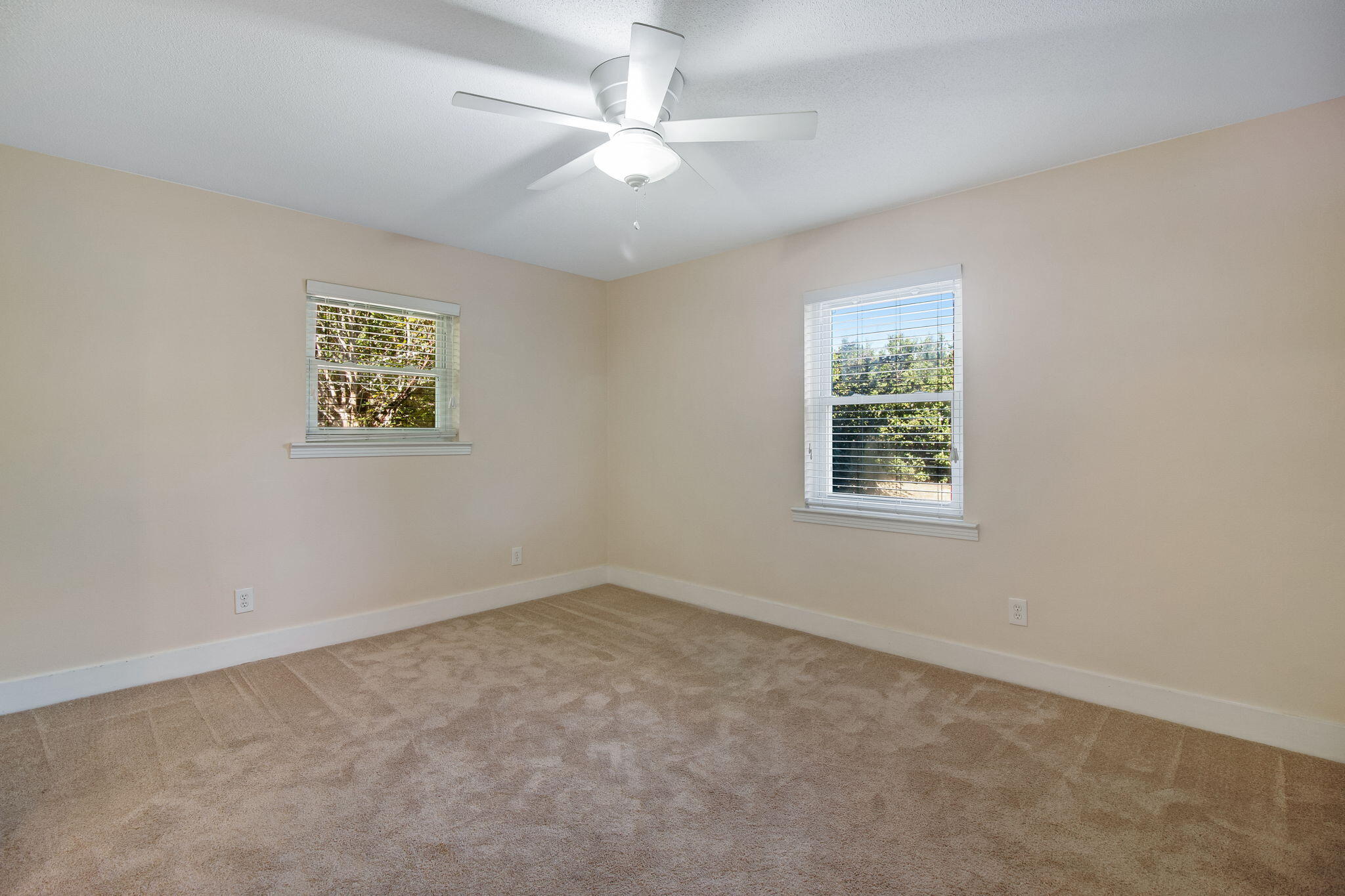 701 Planet Drive Destin, FL 32541 - Photo 23 of 25 an empty room with windows and fan