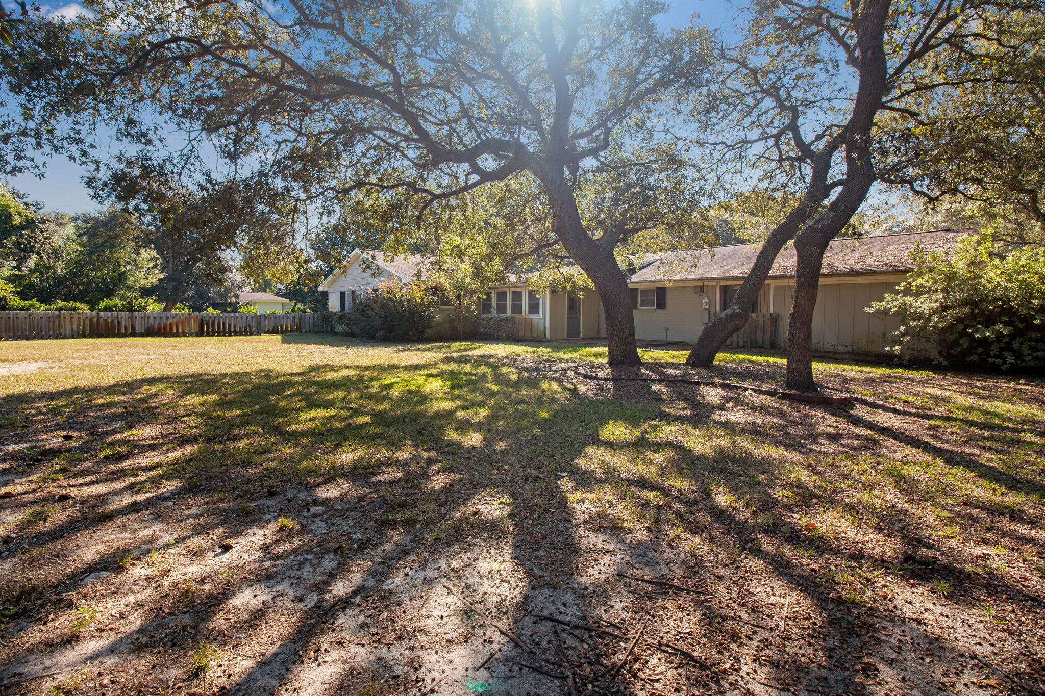 701 Planet Drive Destin, FL 32541 - Photo 5 of 25 a view of road with large trees