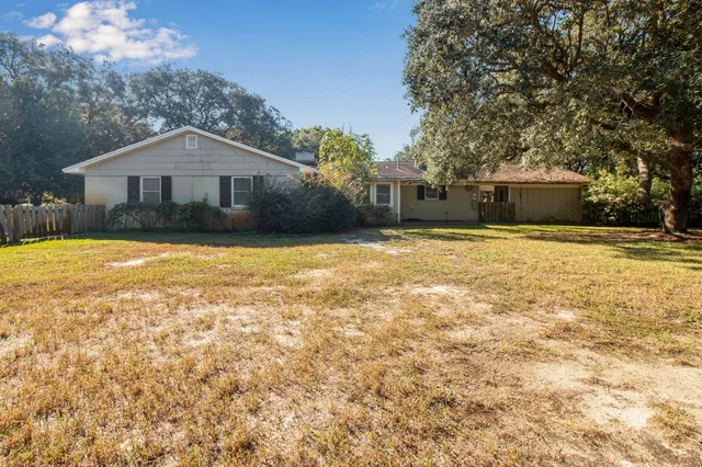 a front view of a house with yard and garage