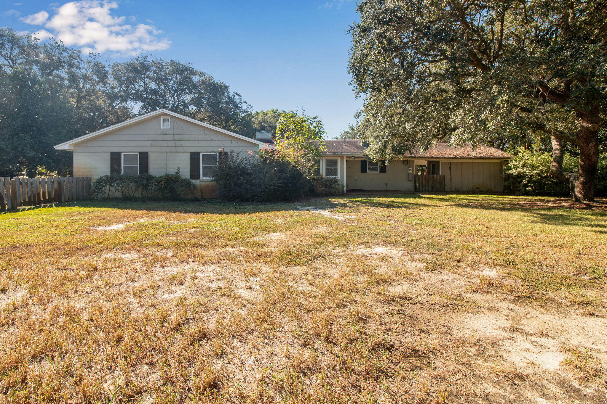 701 Planet Drive Destin, FL 32541 - Photo 6 of 25 a front view of a house with yard and garage