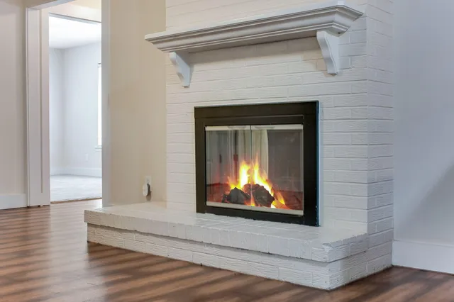 a view of fireplace with wooden floor