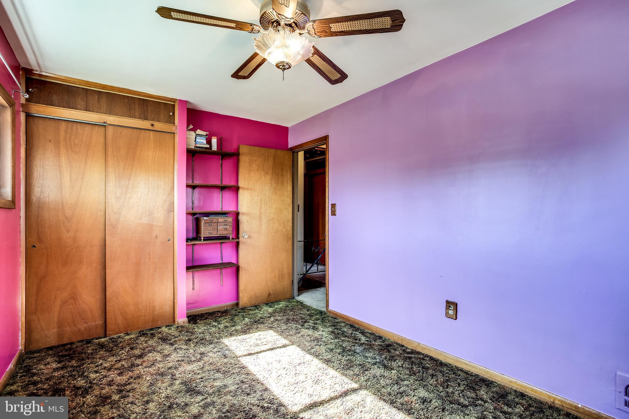 2149 Pitney Road Baltimore, MD 21234 - Photo 13 of 20 a bedroom with a bed and a chandelier