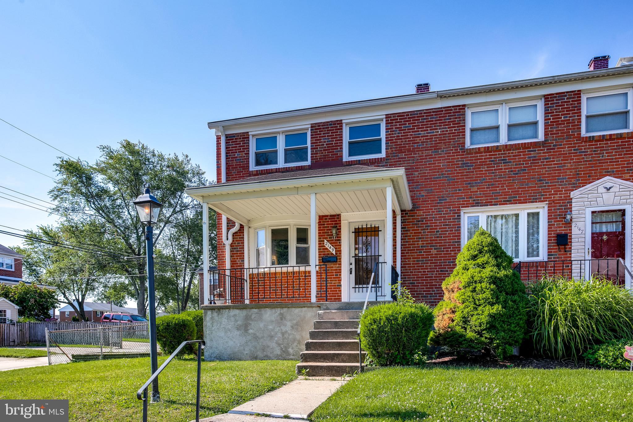 2149 Pitney Road Baltimore, MD 21234 - Photo 19 of 20 a front view of a house with garden and trees