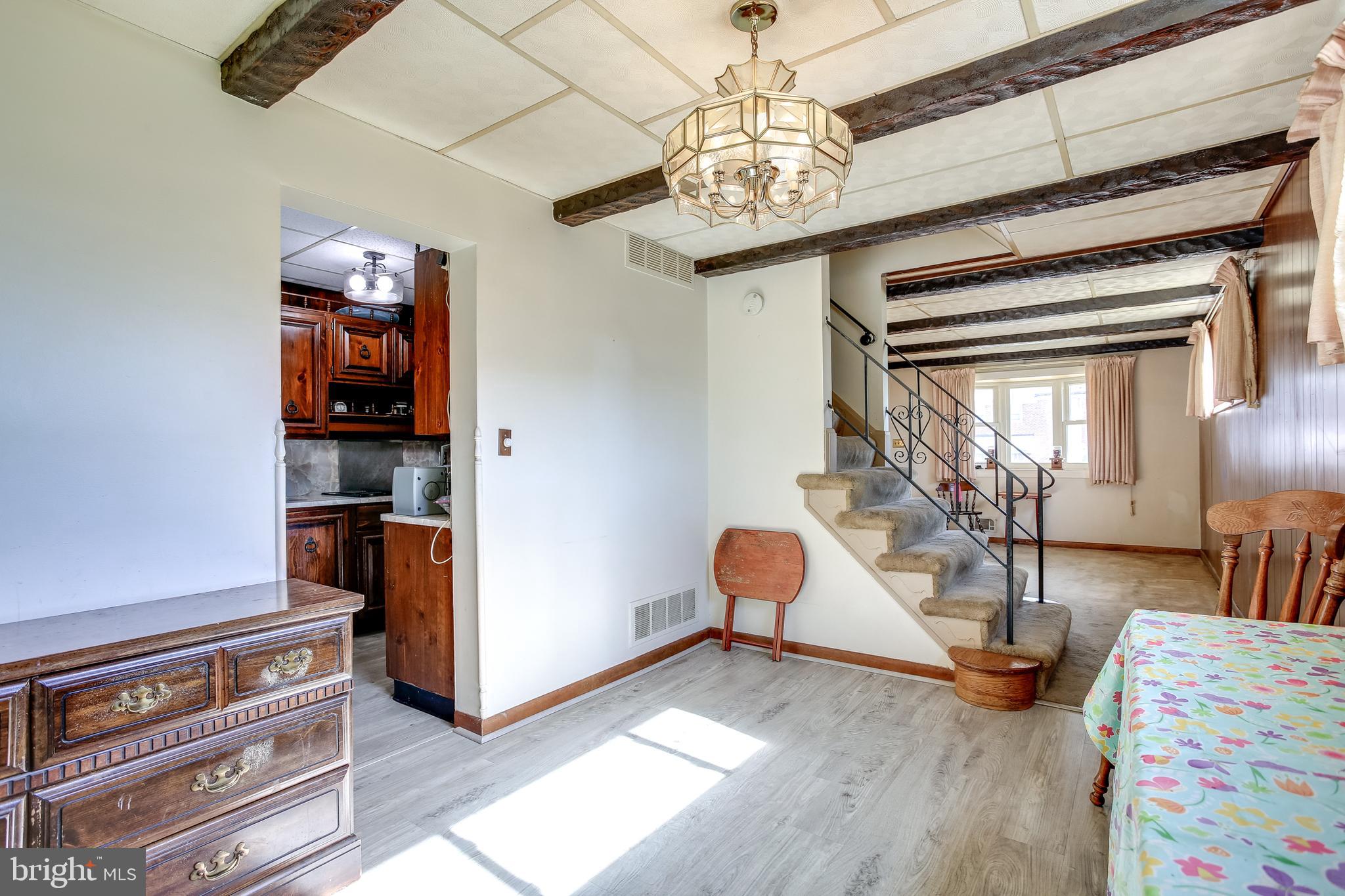 2149 Pitney Road Baltimore, MD 21234 - Photo 6 of 20 a view of hall way with furniture and chandelier