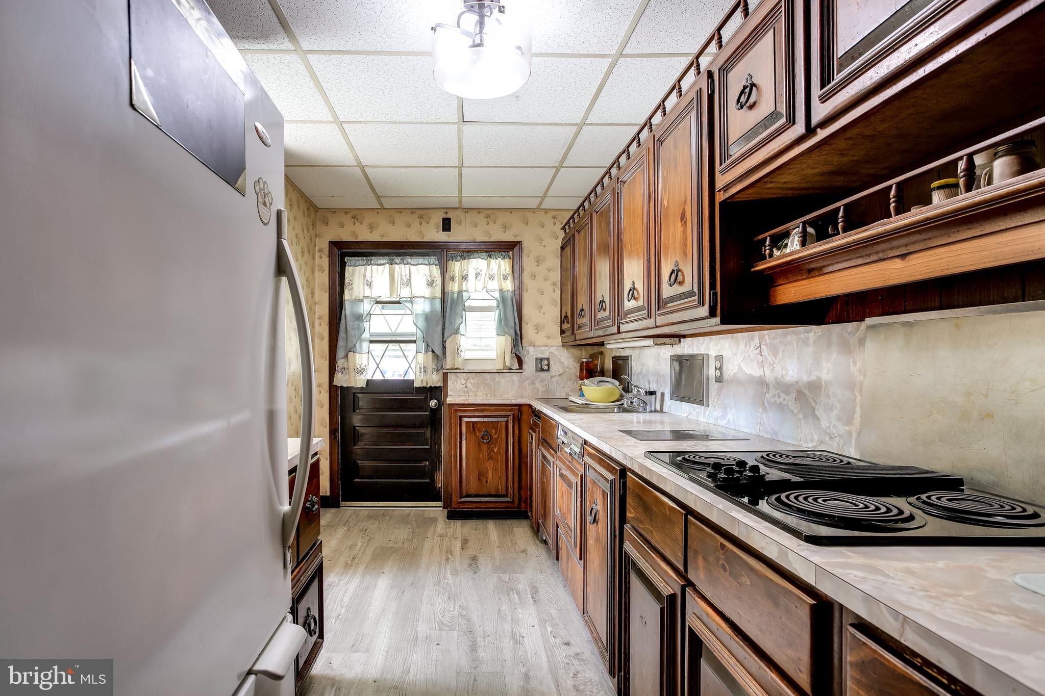 2149 Pitney Road Baltimore, MD 21234 - Photo 9 of 20 a kitchen with a stove and a refrigerator