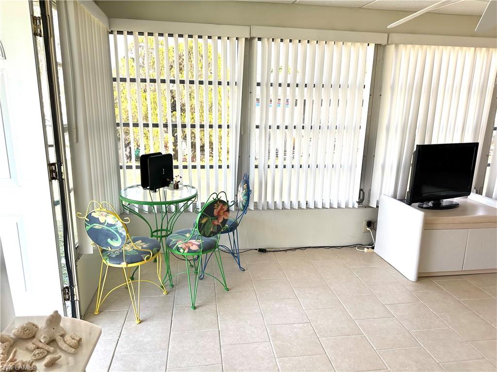26212 Colony Road Bonita Springs, FL 34135 - Photo 14 of 34 Florida room view from the dining room.