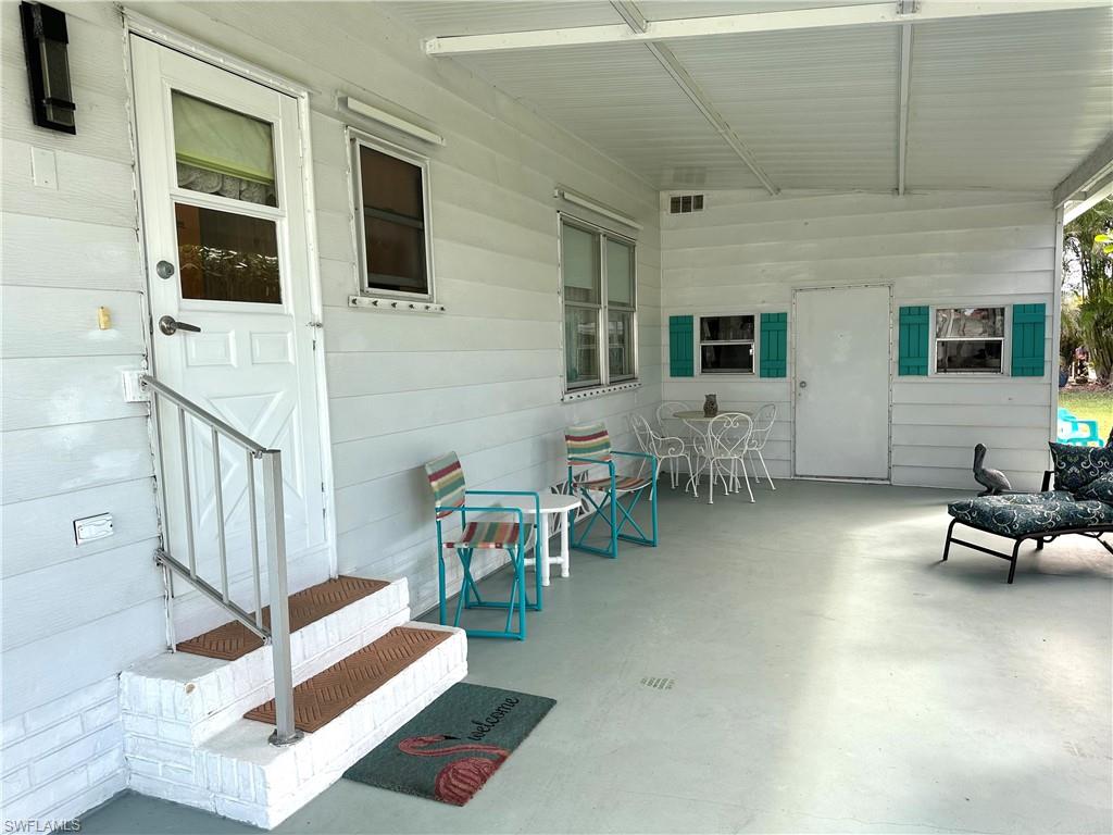 26212 Colony Road Bonita Springs, FL 34135 - Photo 6 of 34 Carport Entrance