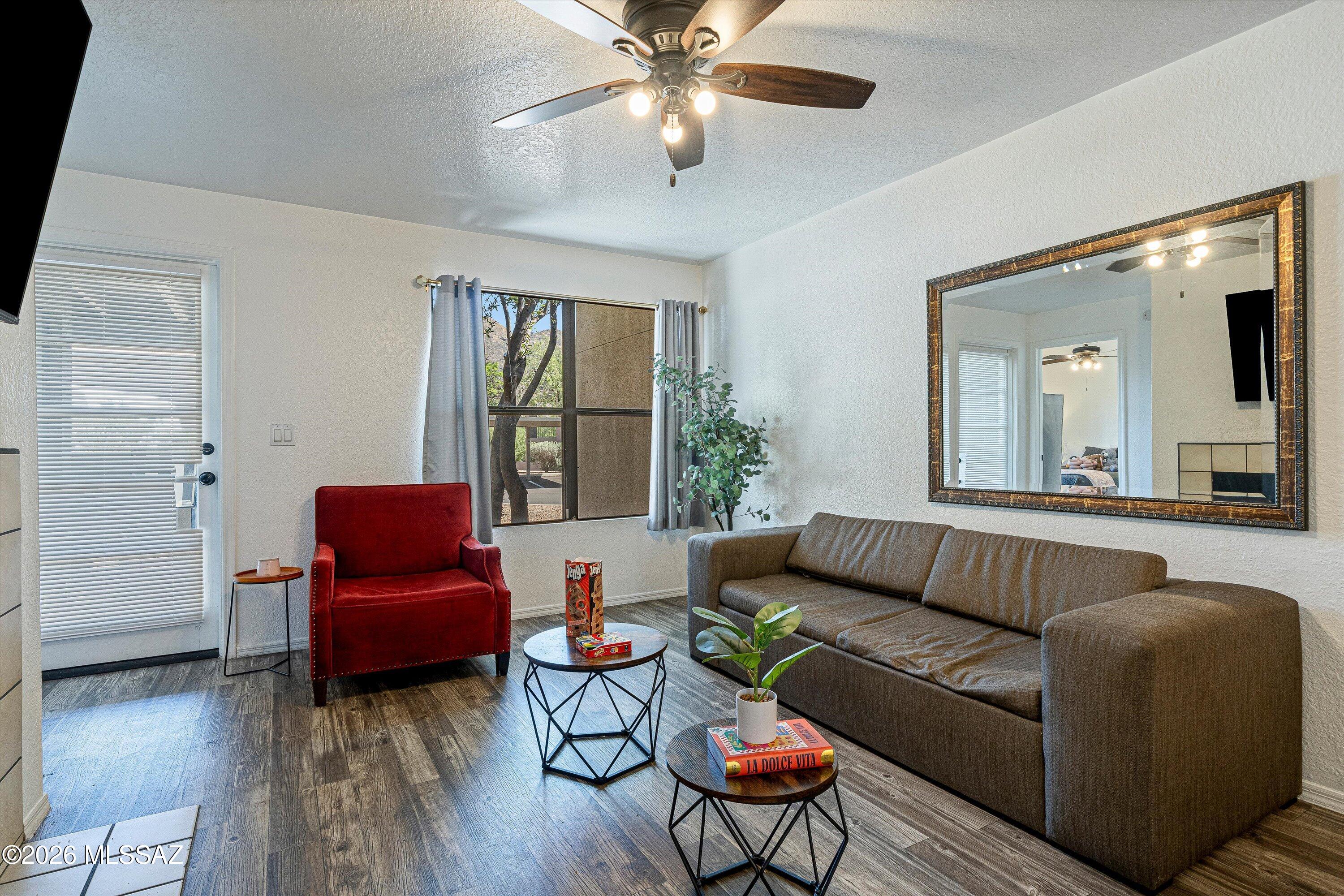 5800 North Kolb Road, Unit 1102 Tucson, AZ 85750 - Photo 2 of 36 a living room with furniture and wooden floor