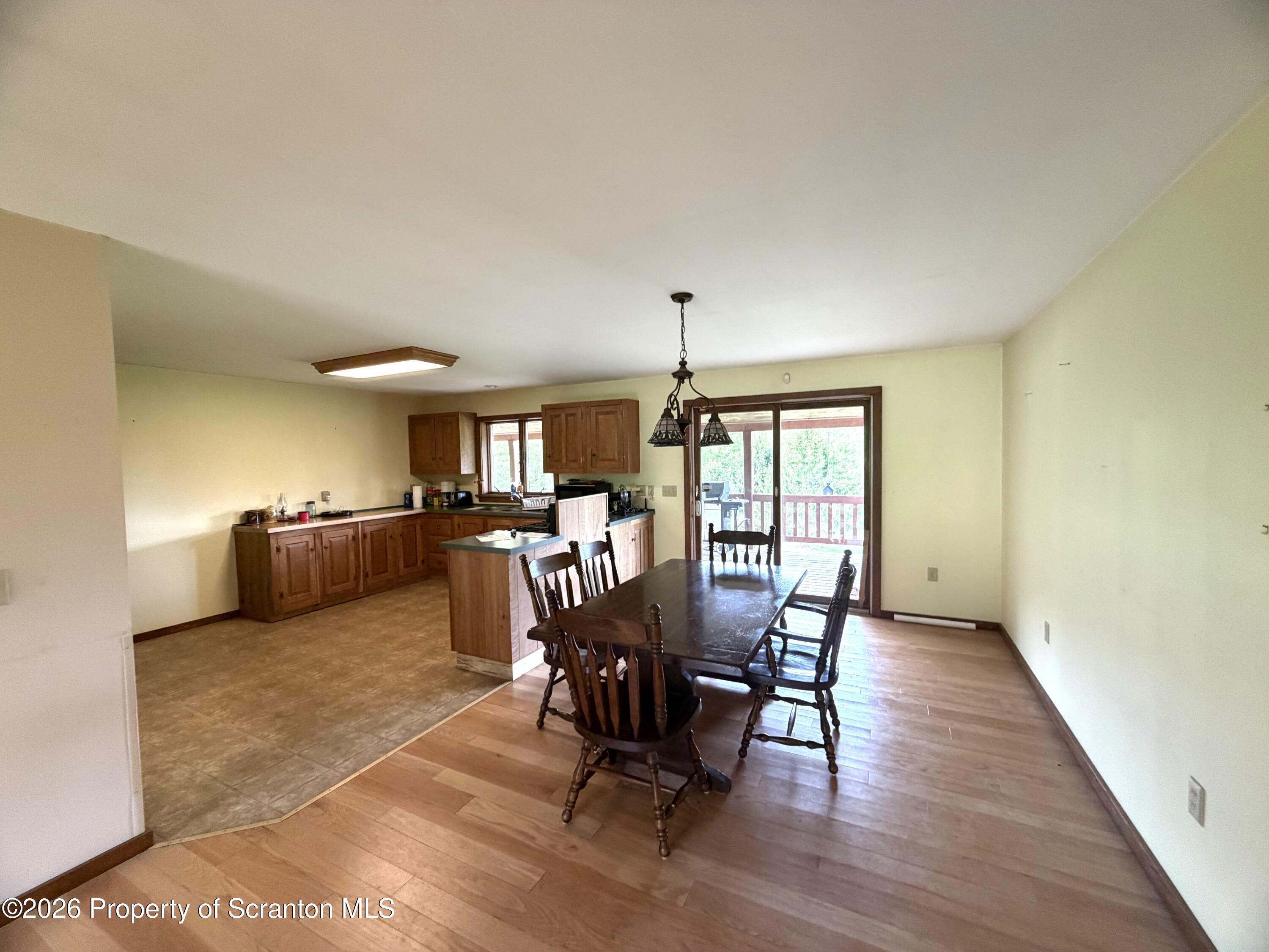 5290 Irish Hill Road Montrose, PA 18801 - Photo 20 of 67 a view of a dining room with furniture and chandelier