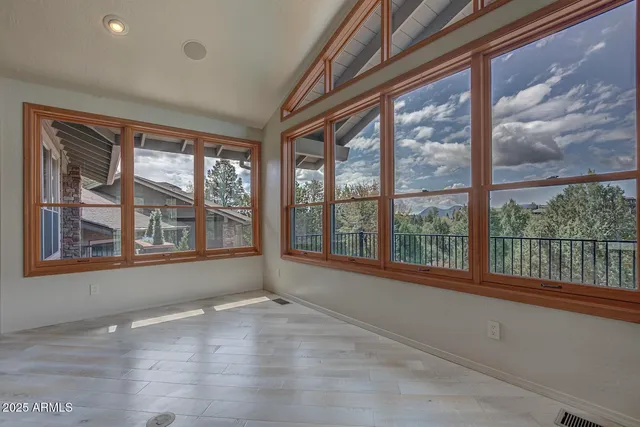 a kitchen with stainless steel appliances granite countertop a sink and a refrigerator