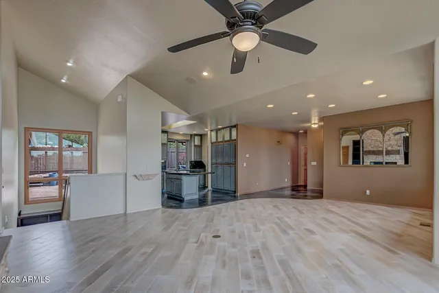 a kitchen with stainless steel appliances granite countertop a sink a stove and a microwave