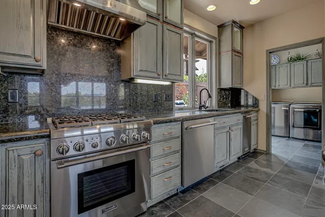 a kitchen with a stove and a refrigerator
