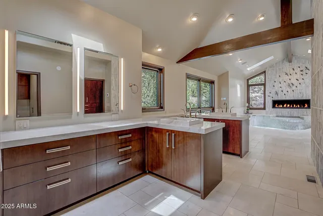 a view of an empty room with a ceiling fan