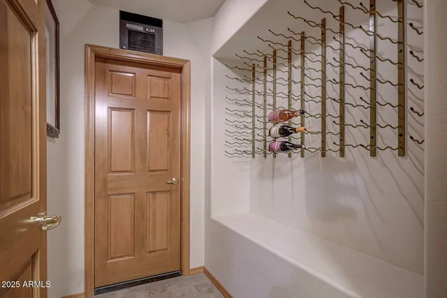 a view of a yard with plants and a bench