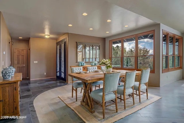wooden floor fireplace and windows in an empty room