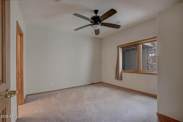 a view of a lush green hillside and houses