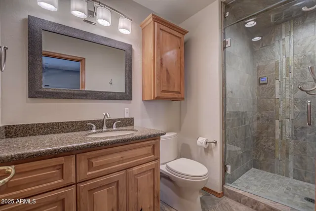 an aerial view of a house with garden space and sitting area