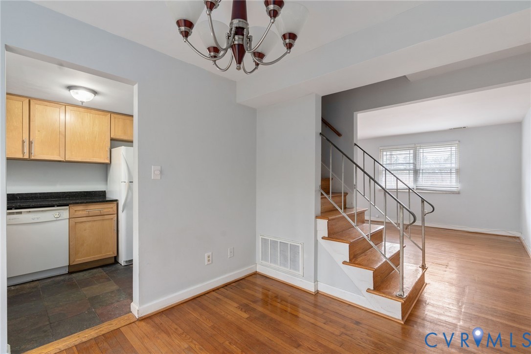 3109 North Parham Road, Unit 17 Henrico, VA 23294 - Photo 13 of 22 a view of entryway and kitchen with wooden floor