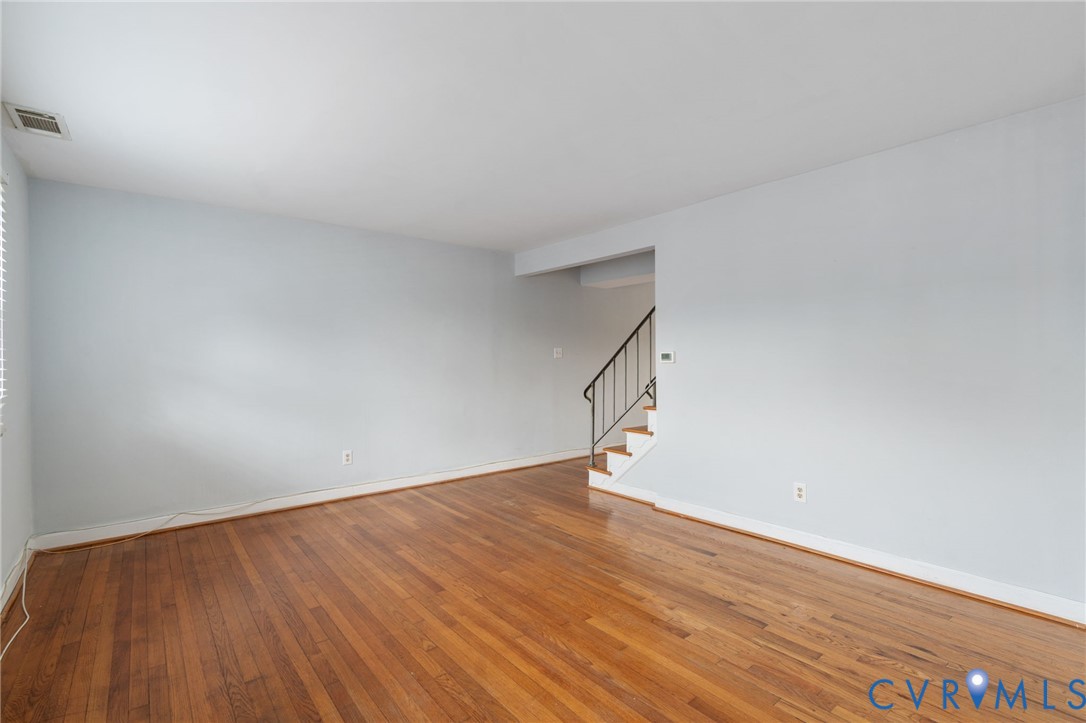 3109 North Parham Road, Unit 17 Henrico, VA 23294 - Photo 7 of 22 a view of an empty room with wooden floor
