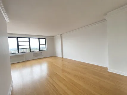 a bedroom with bed and window
