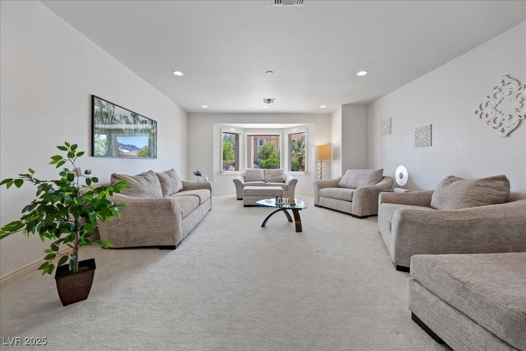 640 Quail Covey Road Henderson, NV 89002 - Photo 9 of 75 Formal Living Room with light carpet and recessed lighting