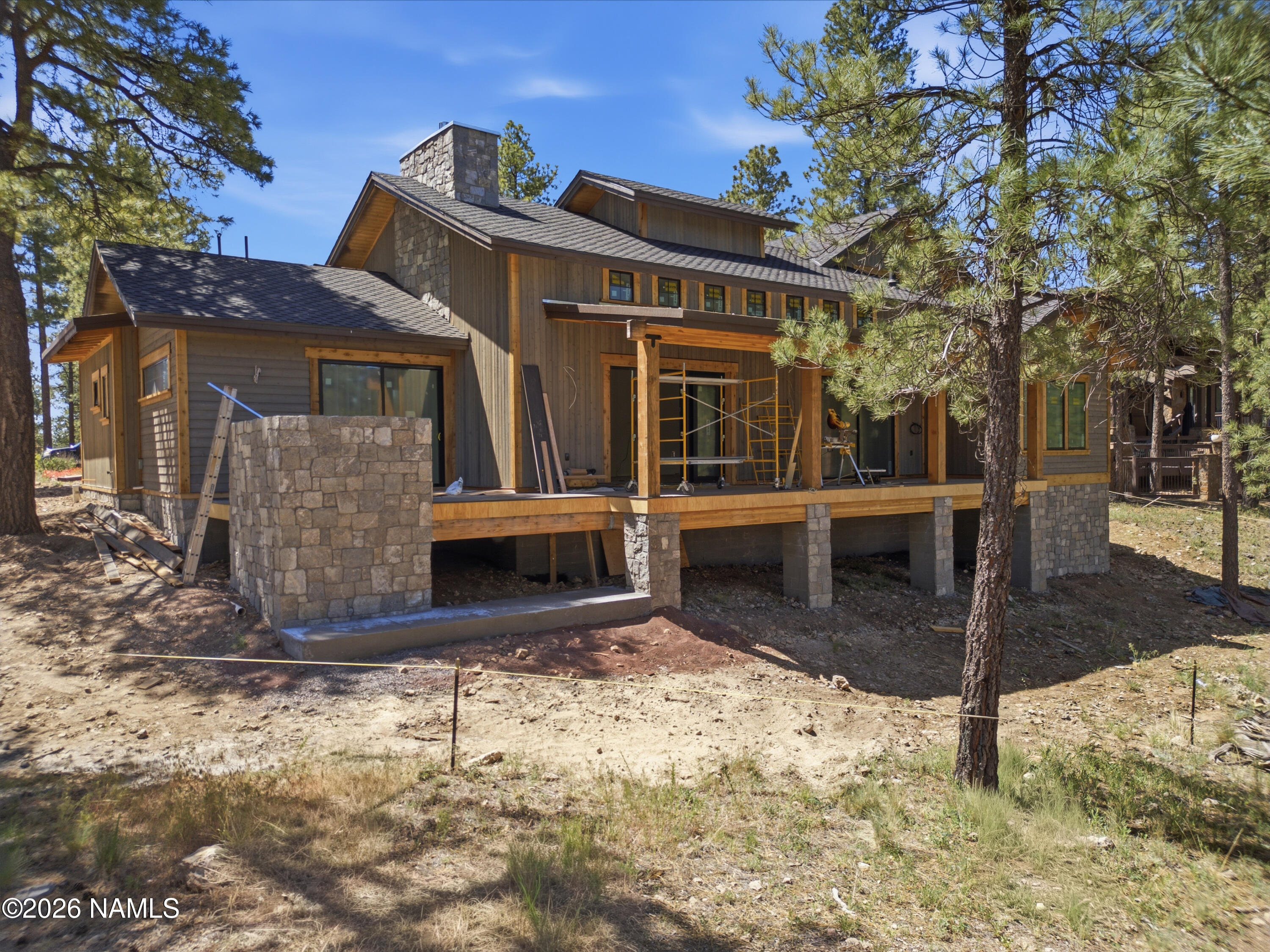 2380 East Del Rae Drive Flagstaff, AZ 86005 - Photo 3 of 26 a view of a house with wooden fence
