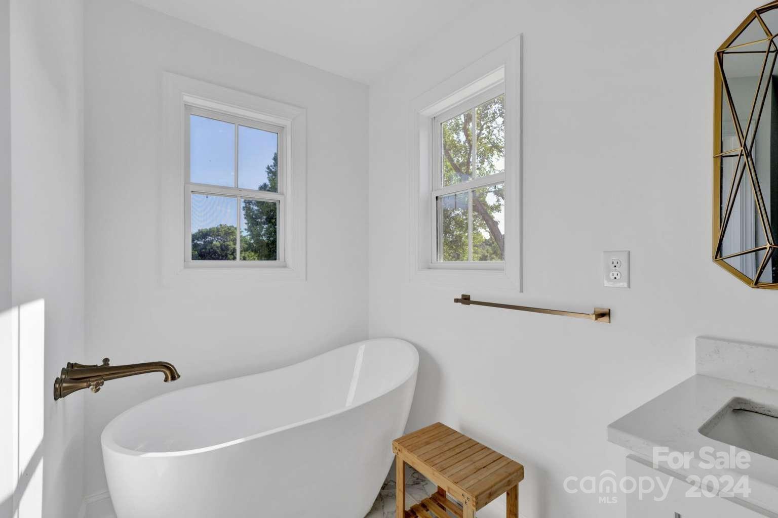 503 Arrow Point Lane Kannapolis, NC 28036 - Photo 14 of 23 a bathroom with a tub a sink and a window