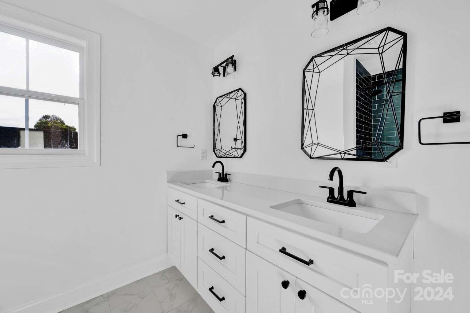 503 Arrow Point Lane Kannapolis, NC 28036 - Photo 17 of 23 a bathroom with double vanity sink and mirror