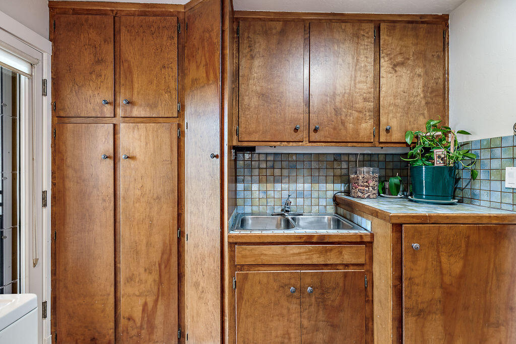 3828 Upper Applegate Road Jacksonville, OR 97530 - Photo 49 of 69 a kitchen with a refrigerator and potted plant