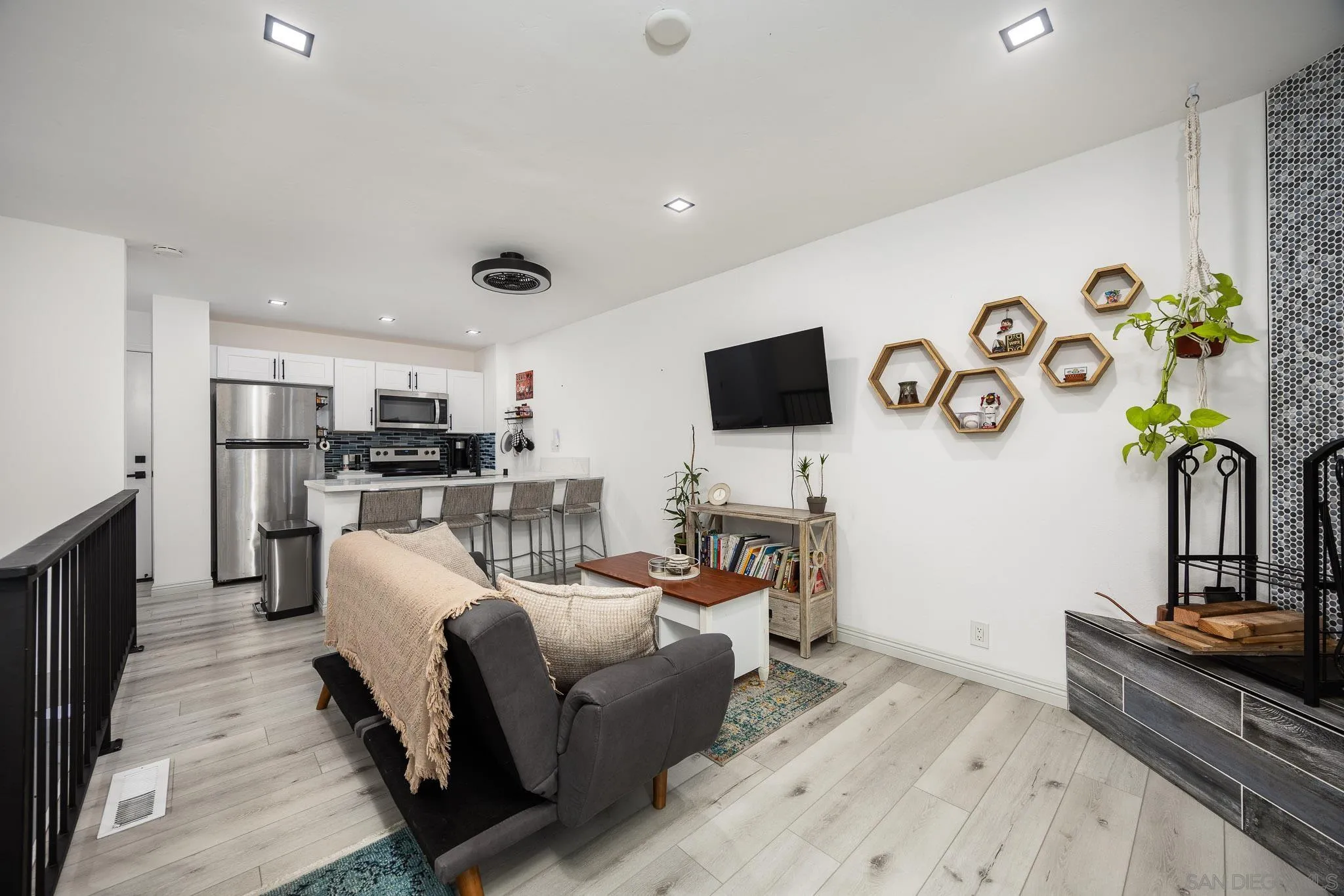 a living room with furniture and a flat screen tv