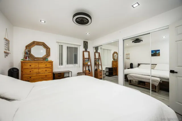 a bed room with a bed and a chandelier