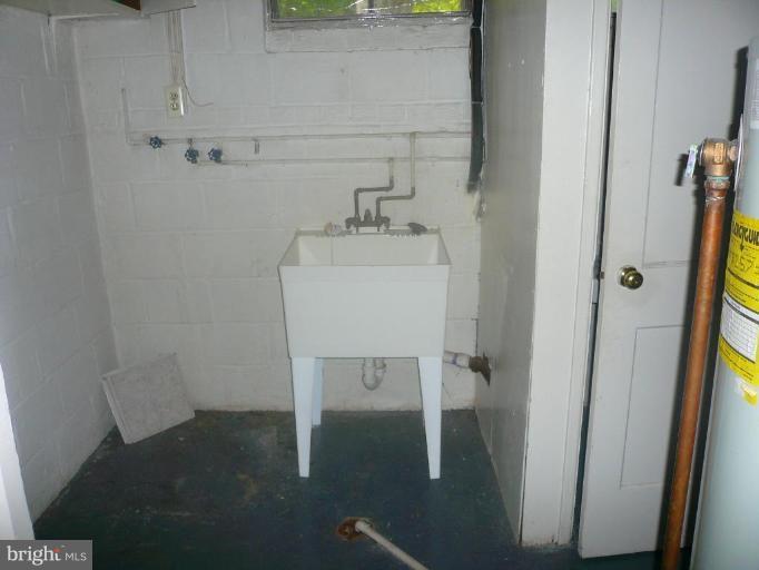 5944 Atteentee Road Springfield, VA 22150 - Photo 5 of 7 a bathroom with a sink and a mirror
