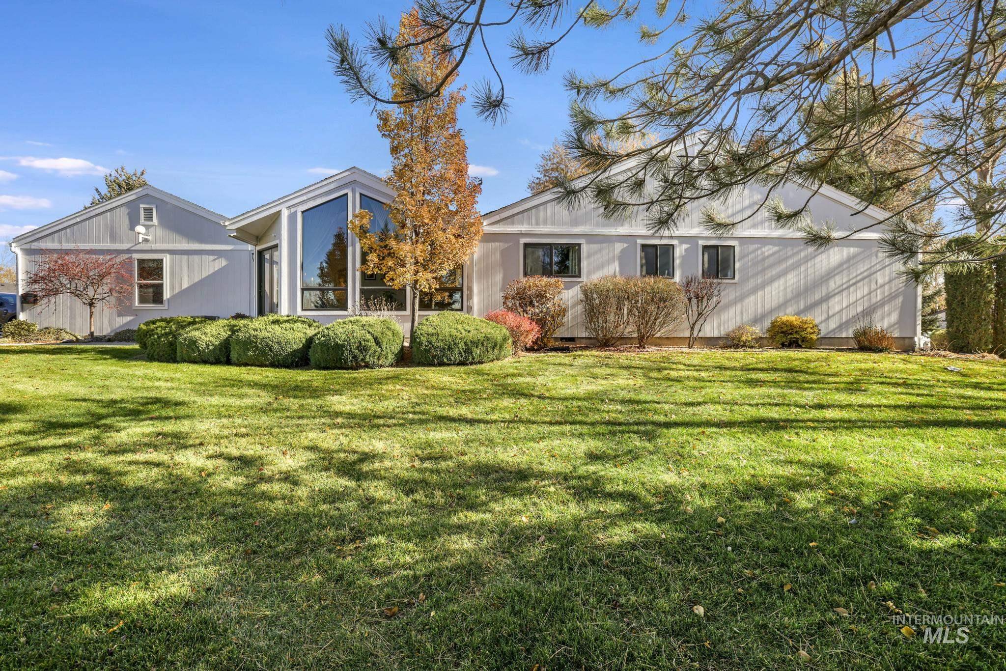 Back of house featuring a yard