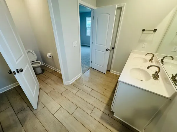 a bathroom with a sink and shower