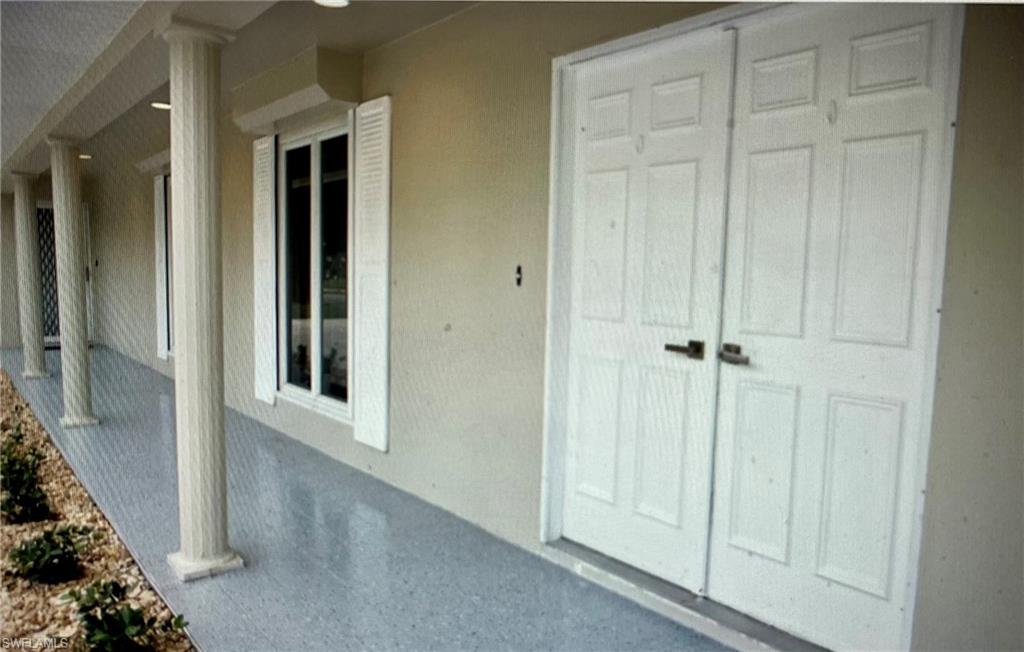 2955 Binnacle Drive Naples, FL 34103 - Photo 3 of 5 a view of a hallway with wooden floor and closet