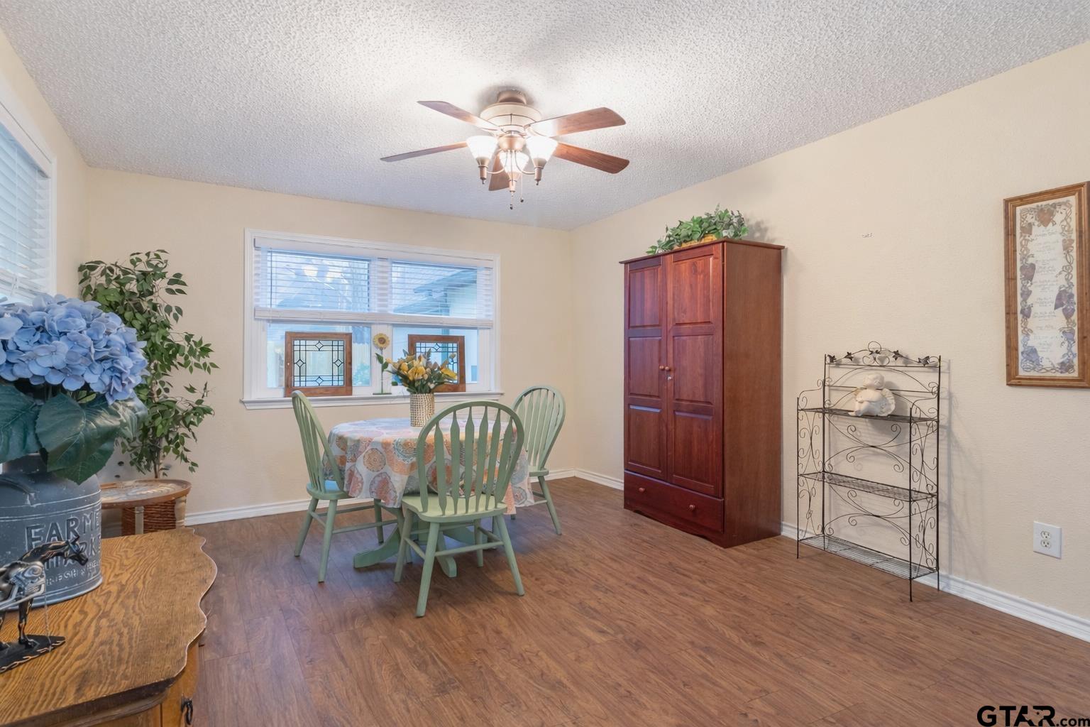 18219 Eastside Road Troup, TX 75789 - Photo 11 of 48 a view of a dining room with furniture and wooden floor