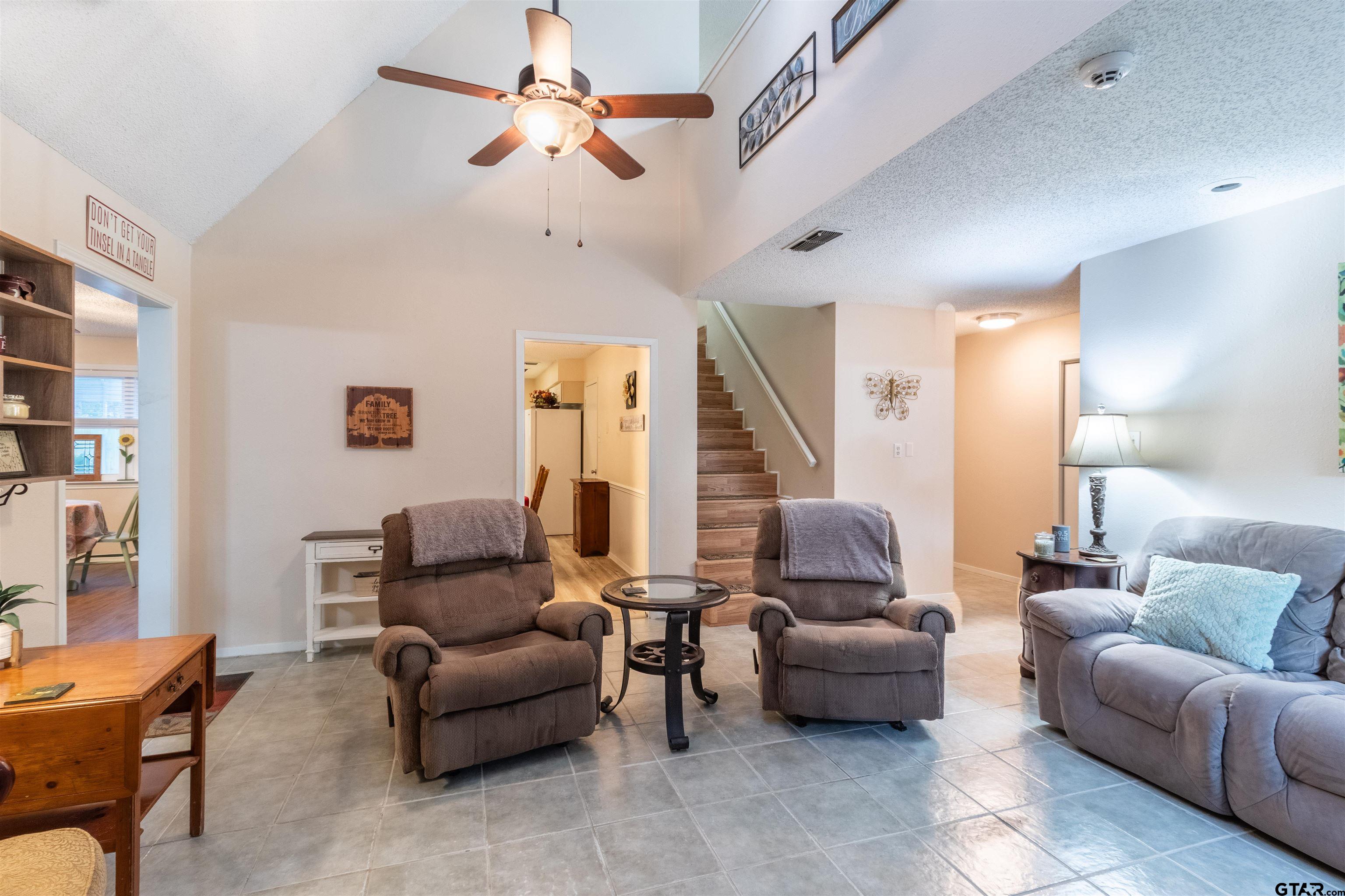 18219 Eastside Road Troup, TX 75789 - Photo 14 of 48 a living room with furniture and a chandelier