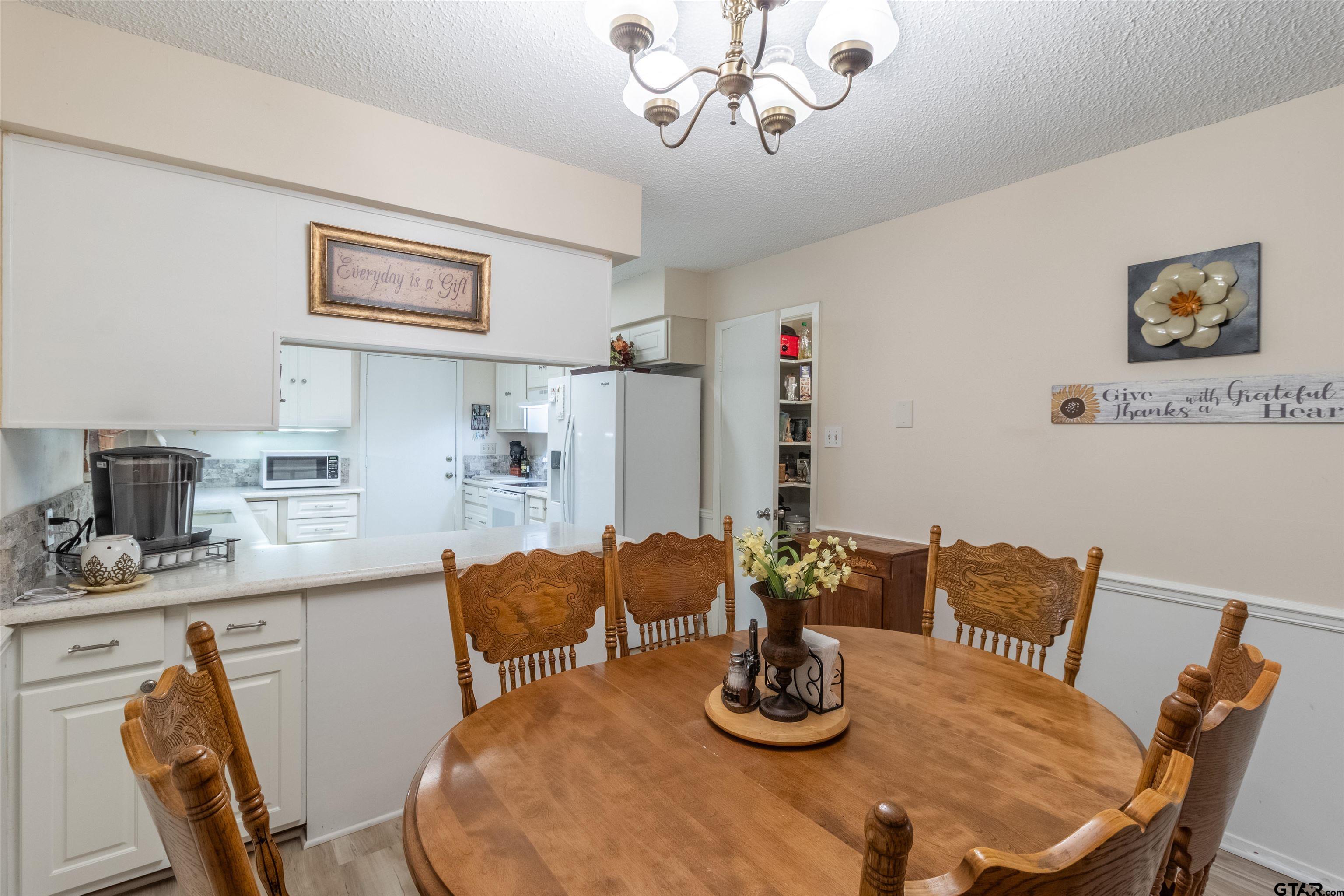18219 Eastside Road Troup, TX 75789 - Photo 18 of 48 a dining room with furniture
