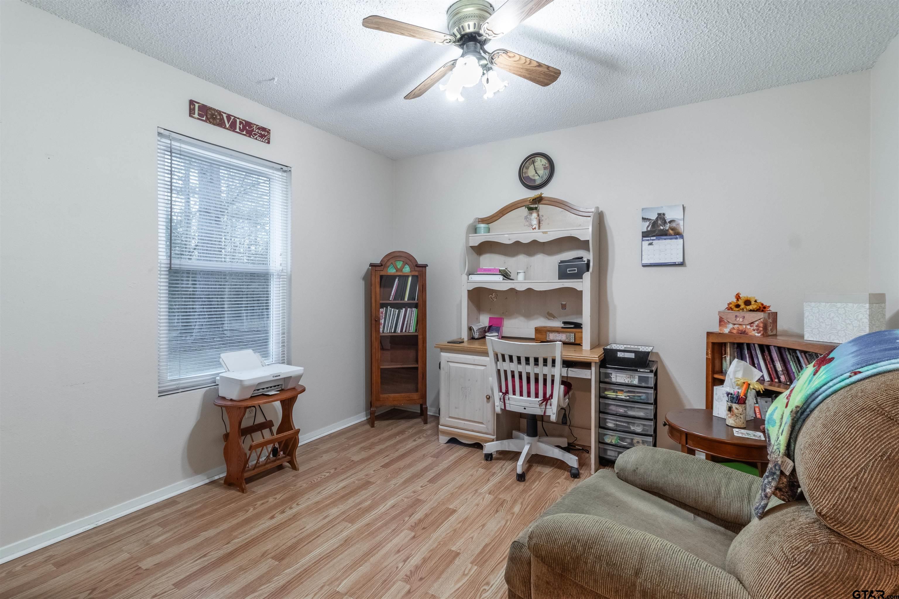 18219 Eastside Road Troup, TX 75789 - Photo 23 of 48 a living room with furniture and a window