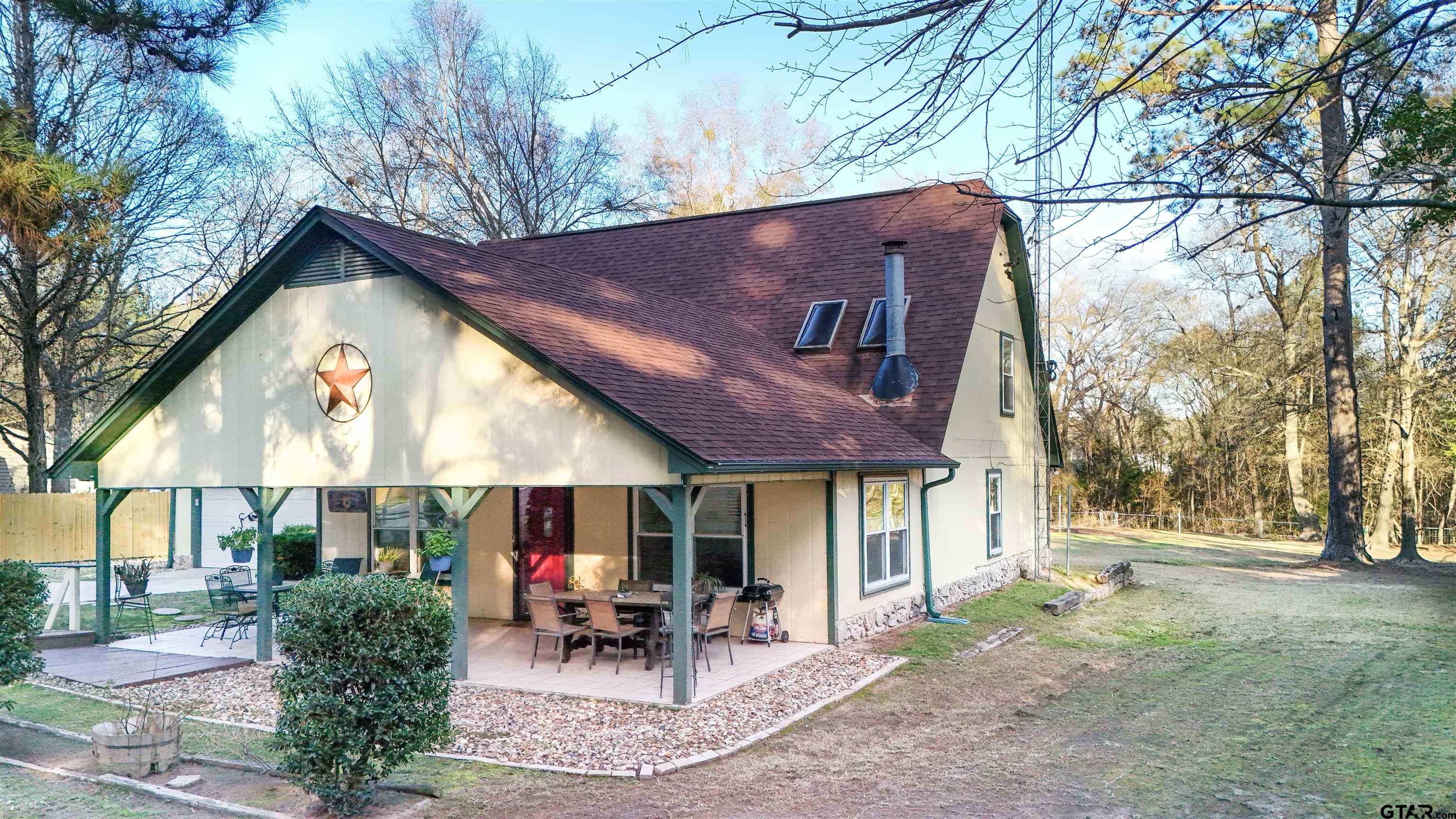 18219 Eastside Road Troup, TX 75789 - Photo 40 of 48 a view of a house with a yard and sitting area