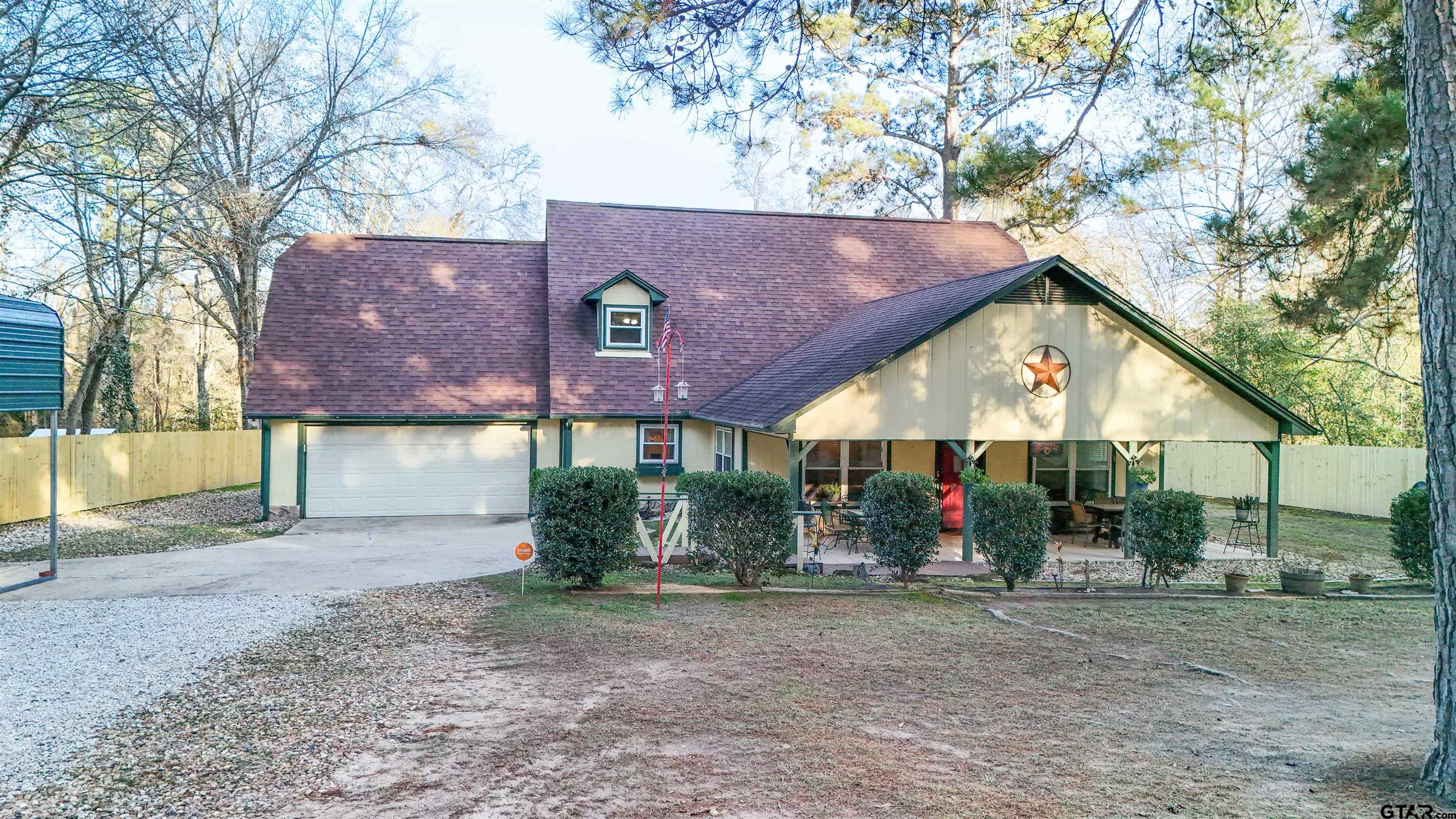 18219 Eastside Road Troup, TX 75789 - Photo 5 of 48 a view of a house with a yard and a car