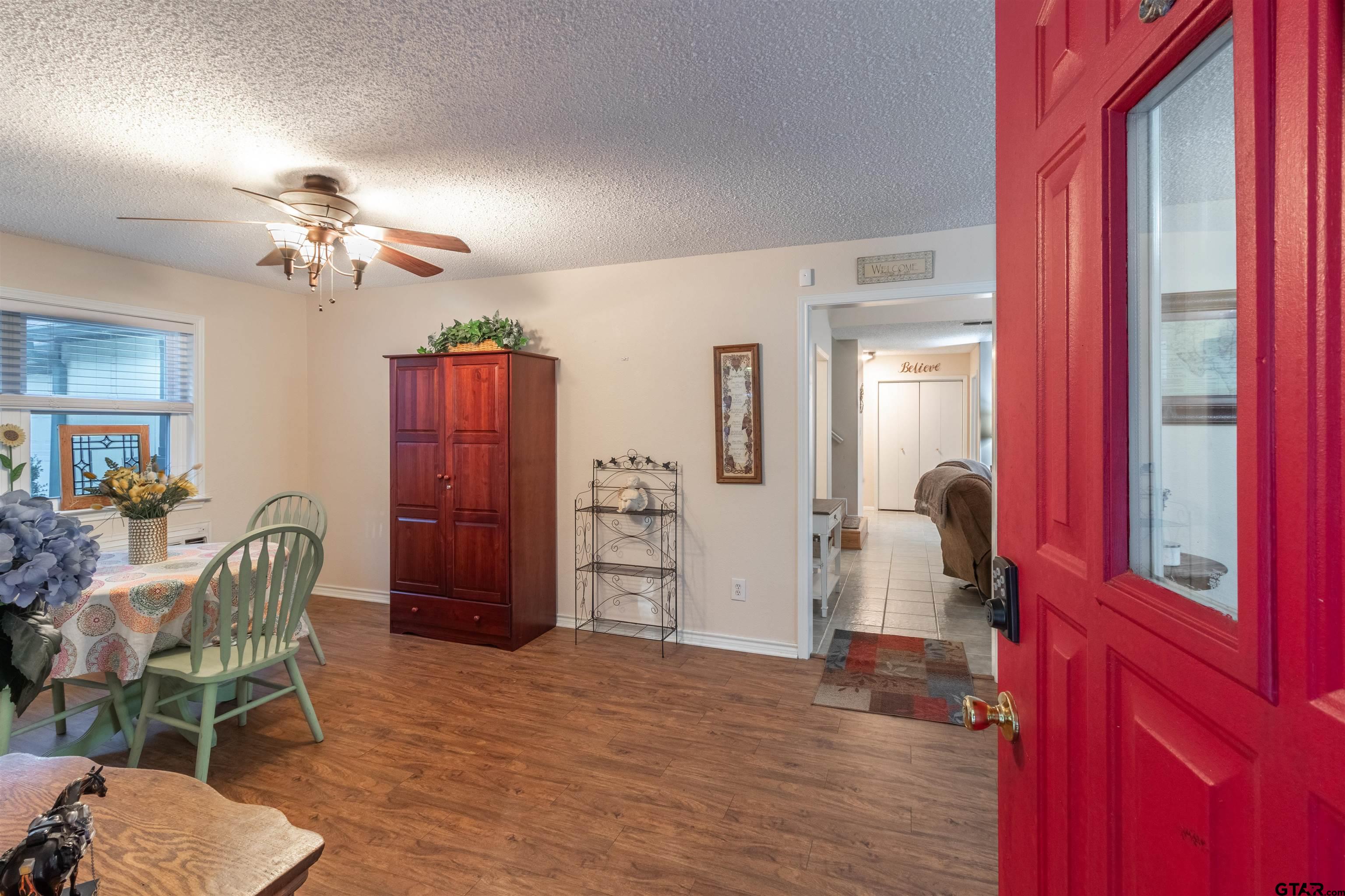 18219 Eastside Road Troup, TX 75789 - Photo 10 of 48 a view of a livingroom with furniture and a hallway