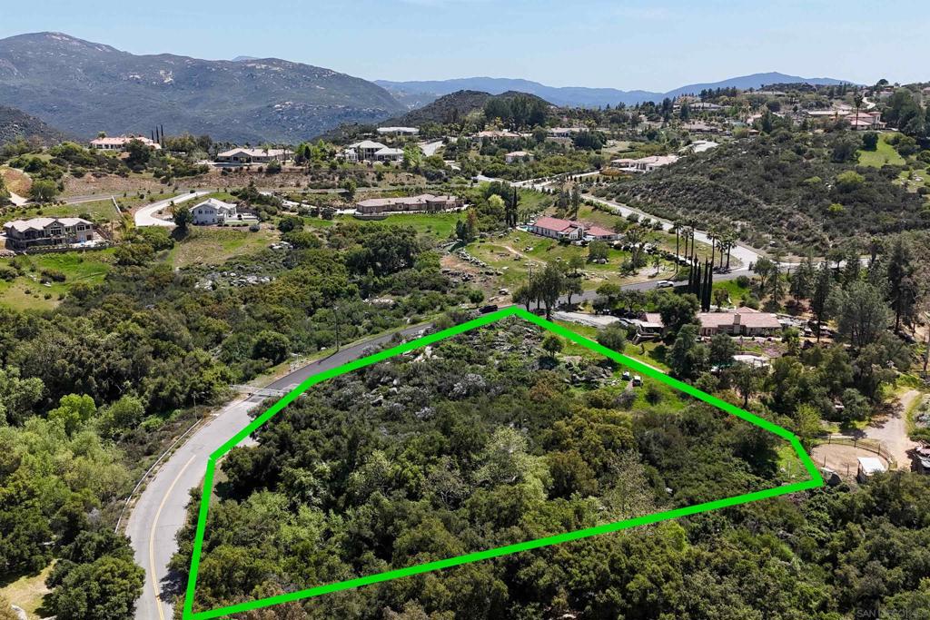an aerial view of residential house and outdoor space