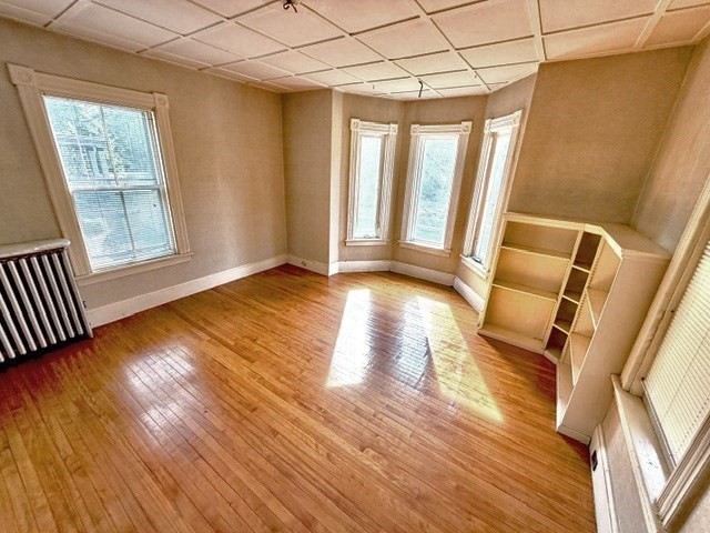 60 Massasoit Street Northampton, MA 01060 - Photo 5 of 19 a view of an empty room with wooden floor and a window