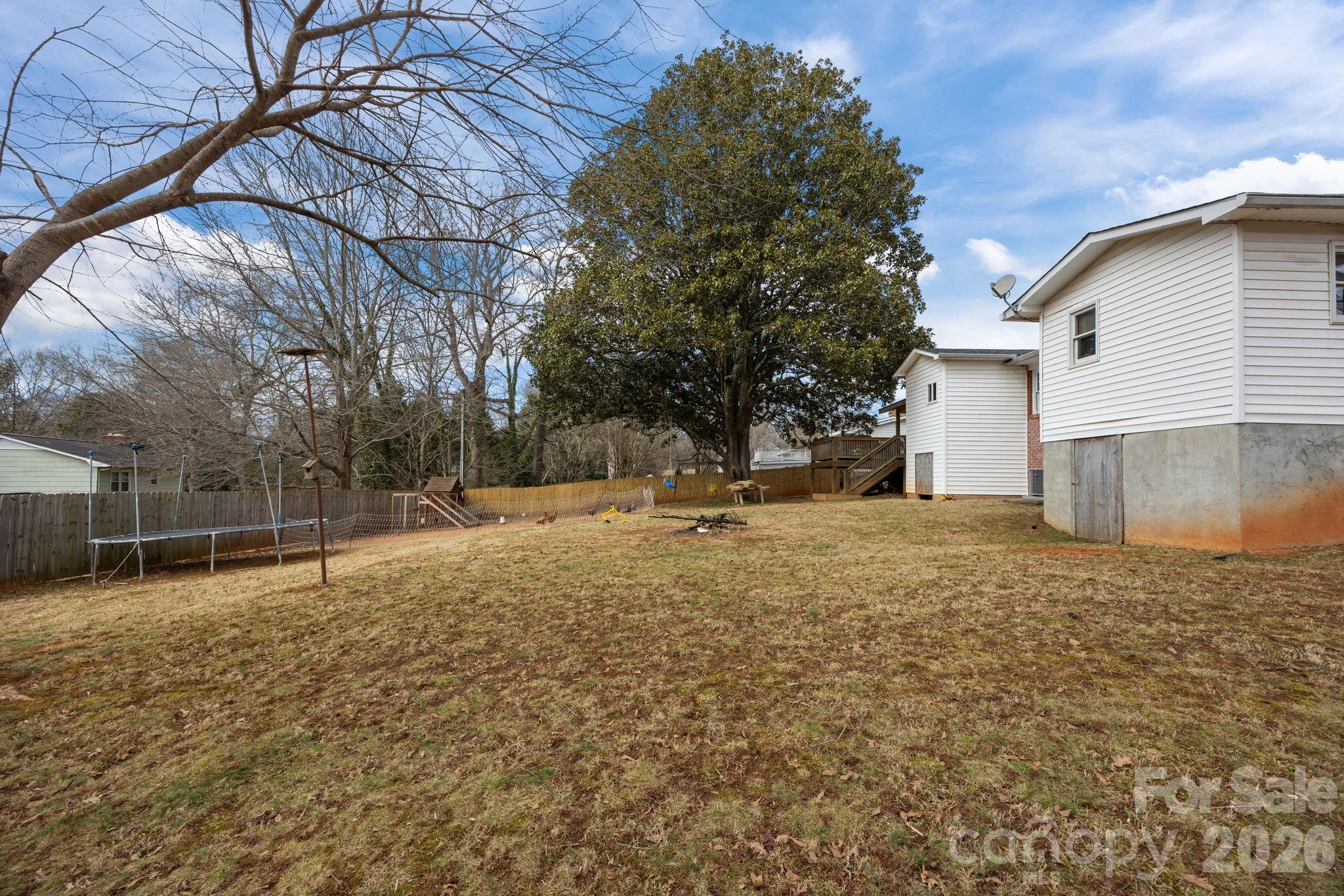 275 Tanner Street Rutherfordton, NC 28139 - Photo 12 of 44 a backyard of a house with lots of green space