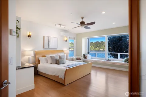 a bedroom with a large bed and a couch