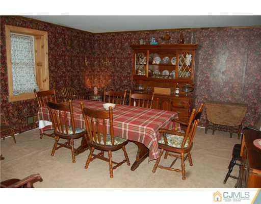 891 Mt Lucas Road Princeton, NJ 08540 - Photo 5 of 8 a dining room with furniture and a floor to ceiling window