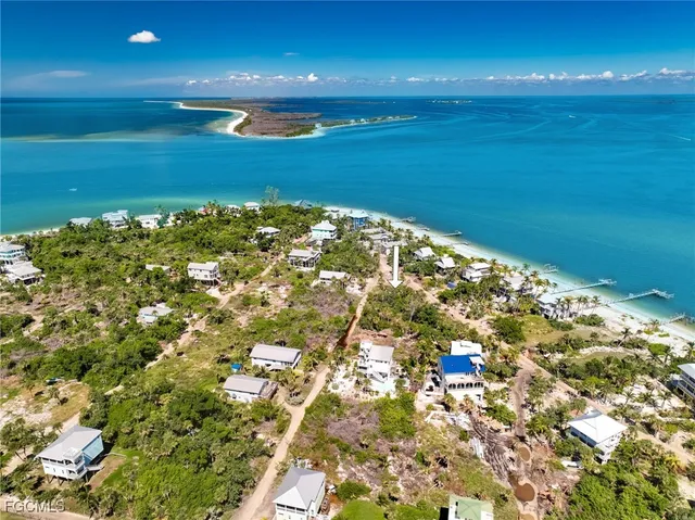 an aerial view of a house with outdoor space