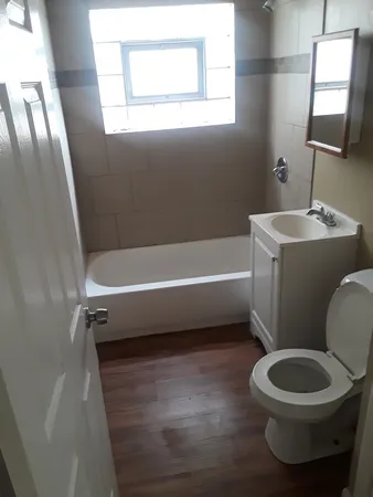 a bathroom with a toilet sink and bathtub