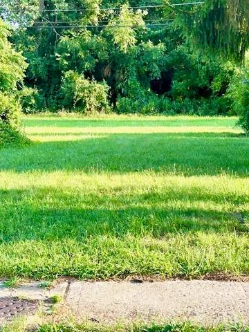 a view of a golf course with a lake